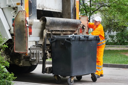 Operatives wearing PPE and loading a van during a clearance